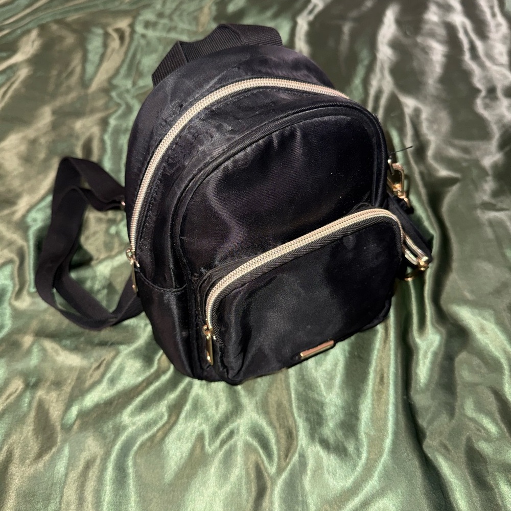 Black Backpack with gold Details